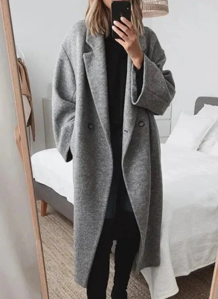 Oversized lange damesmantel met reverskraag en knoopsluiting