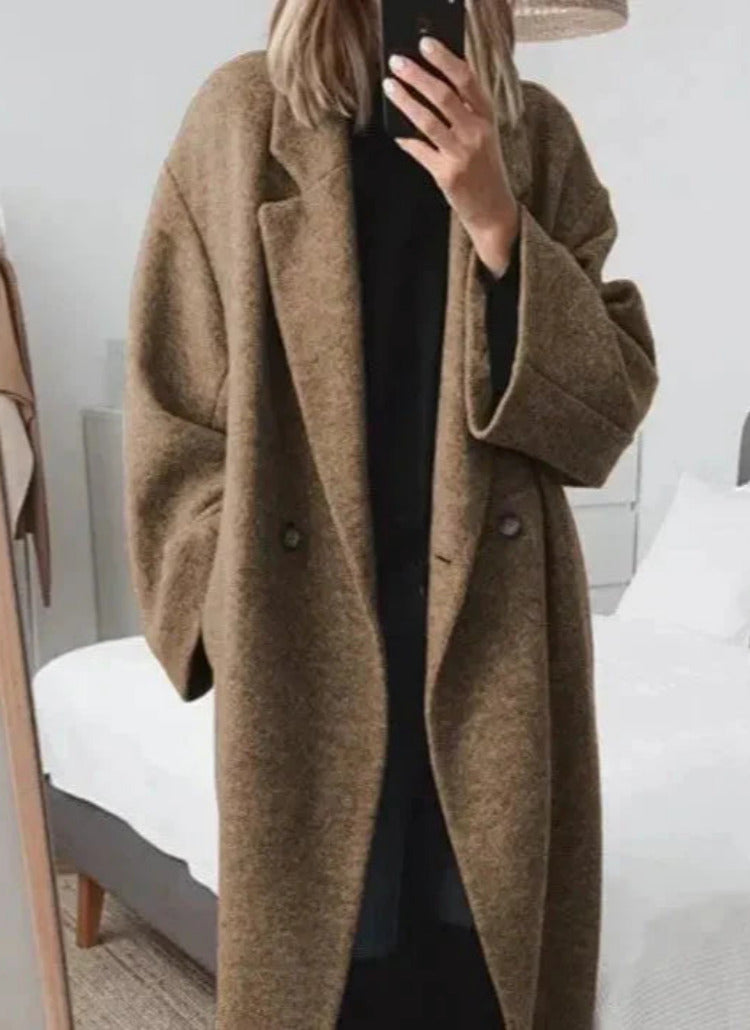 Oversized lange damesmantel met reverskraag en knoopsluiting