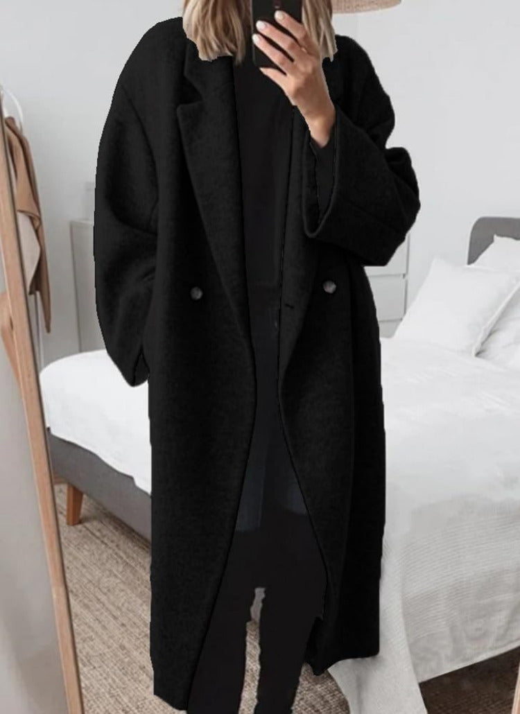 Oversized lange damesmantel met reverskraag en knoopsluiting